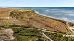 Big stretch of private beach for sale right on the border